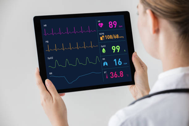 istock Woman doctor watching vital sign with tablet PC. 875524410
