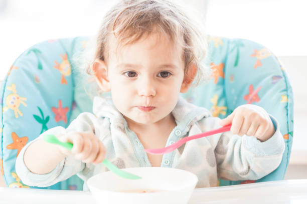 istock The girl is eating very fast 875525320