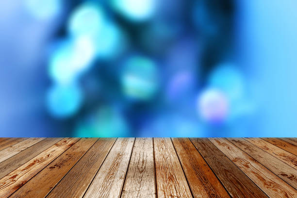 istock Wooden table on blue bokeh background 875531034