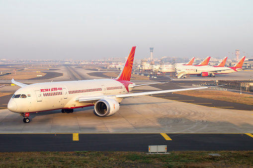 Air India 787 Dreamliner departs as other fleet of Boeing 777, 747 is seen in the back