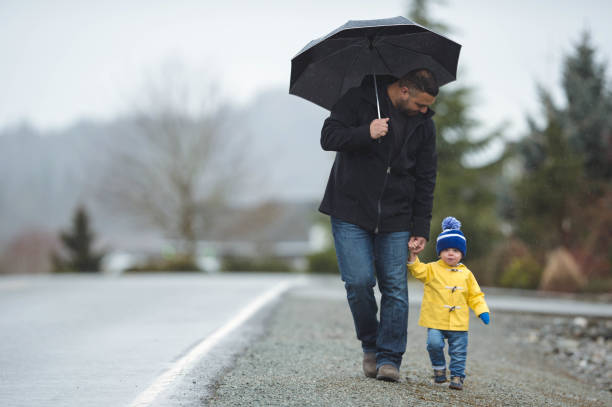 istock Family Walk in the Rain 875532640