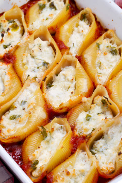 istock ?onchiglie pasta stuffed with three cheeses with tomato sauce 875534668