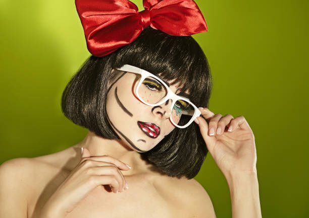 Funny mime girl with a red bow Portrait of funny mime girl with a theatrical makeup and red bow in a spectacles pantomime dame stock pictures, royalty-free photos & images