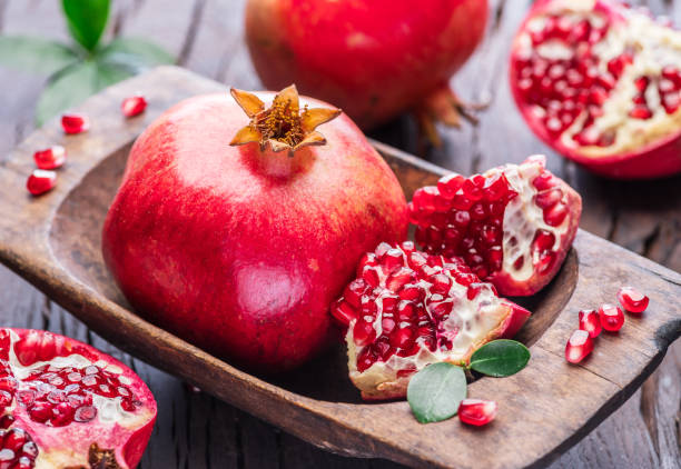 istock Ripe pomegranate fruits. 875547498