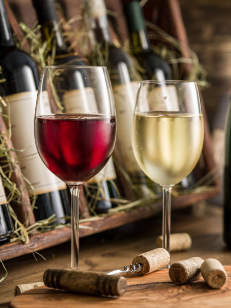 istock Wine bottles on the wooden shelf. 875547900