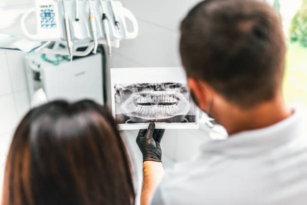 istock Dentist working in dental clinic with patient 875551438