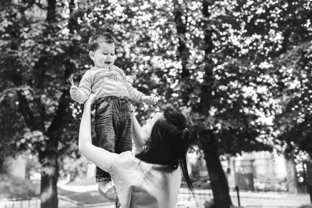 istock Young mother with her little son outdoor 875551942