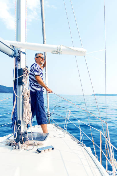istock Man enjoying sailing with sailboat 875554472