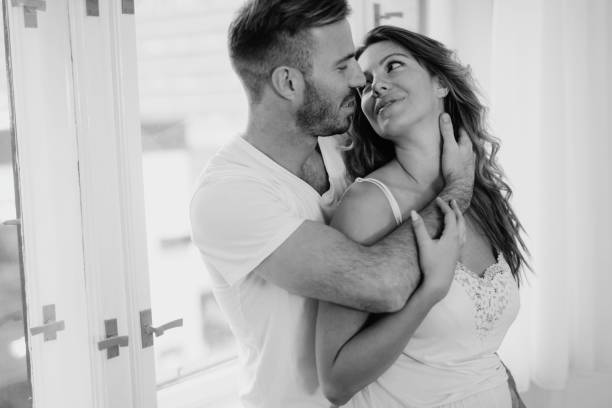 istock Attractive couple sharing intimate moments in bedroom 875554642