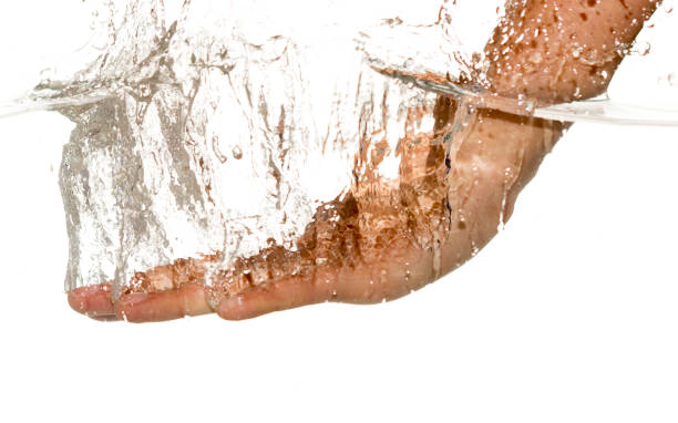 istock hand in water isolated on white background 875554826