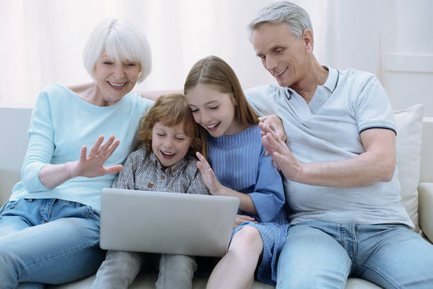 istock Happy family discovering online communication 875557360