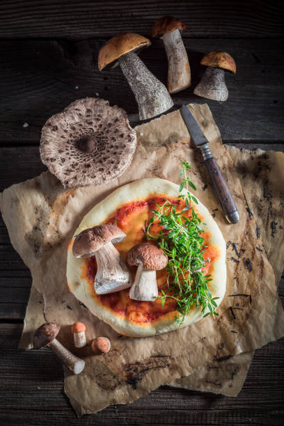 istock Hot and fresh rustic pizza on old wooden table 875558360