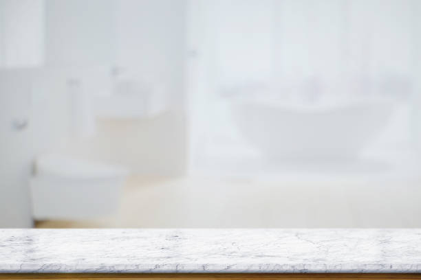istock Marble top table with white blurred bathroom interior Background. for product display montage. 875558424