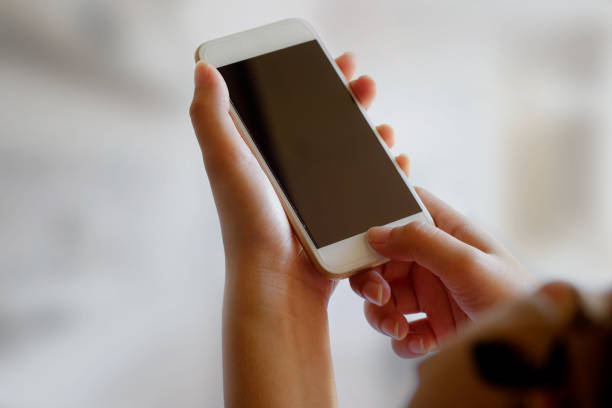 istock Business woman using smartphone for connect online. mobile phone blank screen for graphics display montage. 875558426