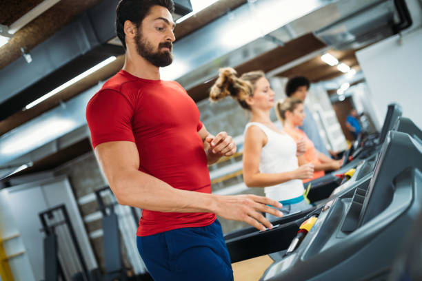 istock Young handsome man doing cardio training in gym 875558742