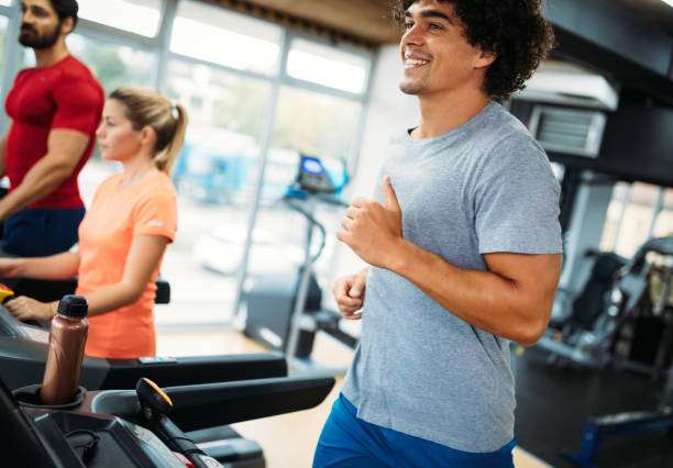 istock Young handsome man doing cardio training in gym 875561042