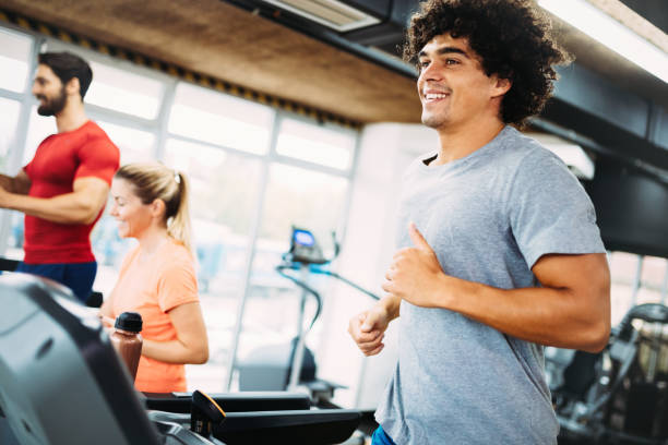 istock Young handsome man doing cardio training in gym 875561092
