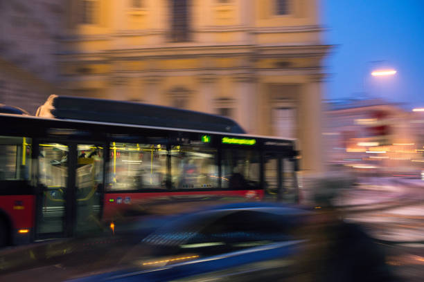 istock bus moving fast in the night city motion blur 875564608