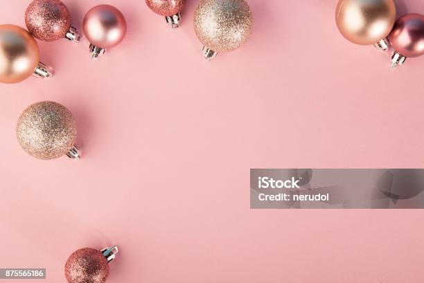 From Above Shot Of Bright Glittering Baubles Composed In Row On Pink Background Stock Photo - Download Image Now