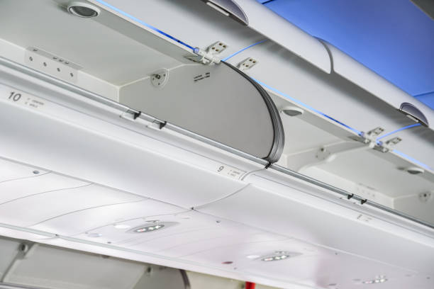 istock the cabin luggage on airplane 875568352