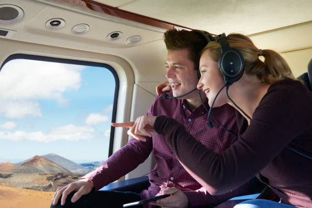 istock Couple On Vacation Taking Ride In Helicopter 875569208