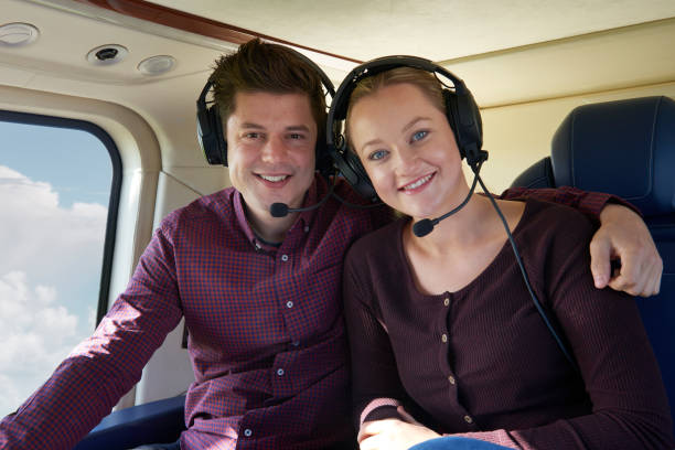 istock Couple On Vacation Taking Ride In Helicopter 875569416