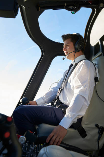 istock Pilot In Cockpit Of Helicopter During Flight 875570220