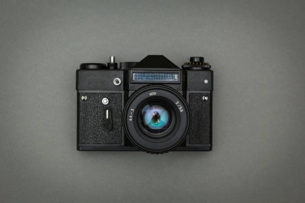 istock The black camera is isolated on a gray background. 875578982