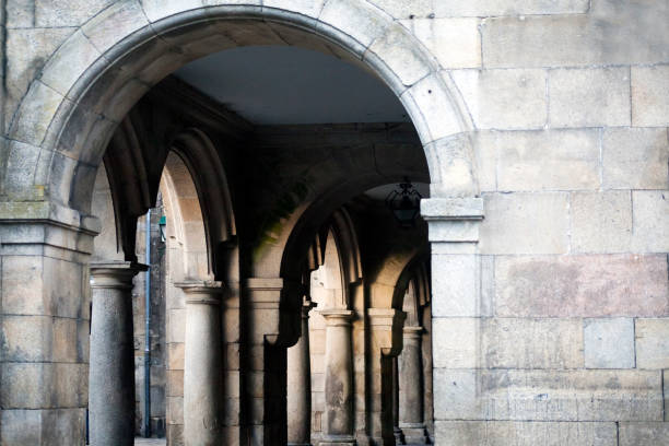 istock Street view in Santiago de Compostela, arcade, stone wall and columns. 875579944