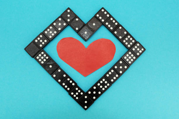 istock Heart of black bones dominoes. 875580030