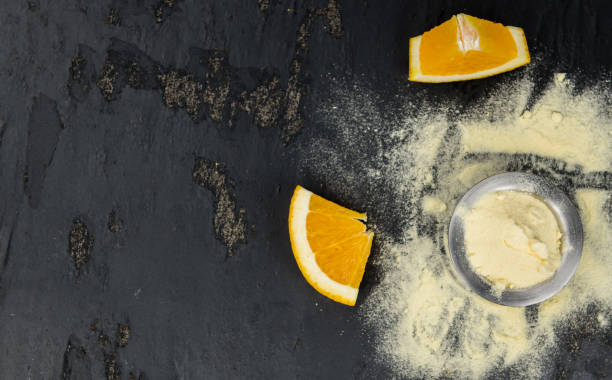 istock Orange fruit powder on a slate slab 875590884
