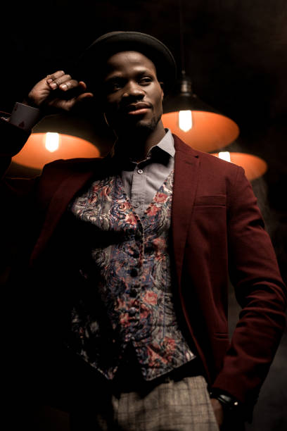 istock man in dark room with lamps 875591044