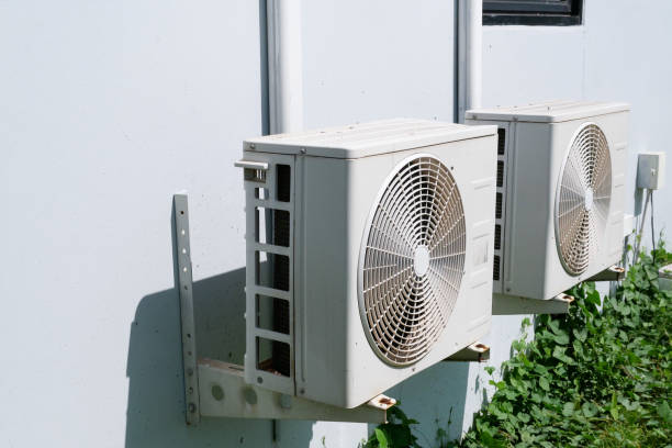 Air conditioner condenser unit Air conditioner condenser unit at a concrete wall pump dress shoe stock pictures, royalty-free photos & images