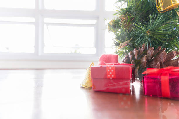 istock Christmas background with gift boxes and fir tree branches on wooden 875592360