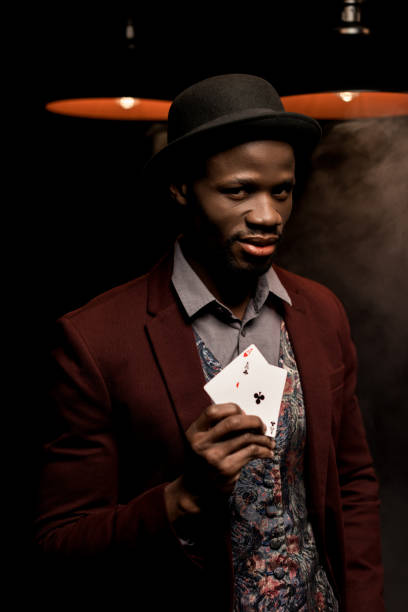 istock african american man with playing cards 875592618