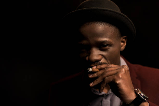 istock african american man smoking cigar 875596900