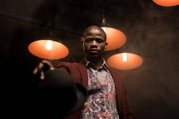istock fashionable african american man with hat 875599616