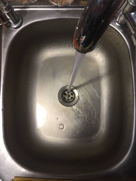istock Tap water flowing into sink 875602568