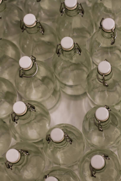 Photo close up many empty glass transparent  swing top bottle
