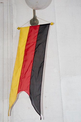 german banner flag on white wall in germany city