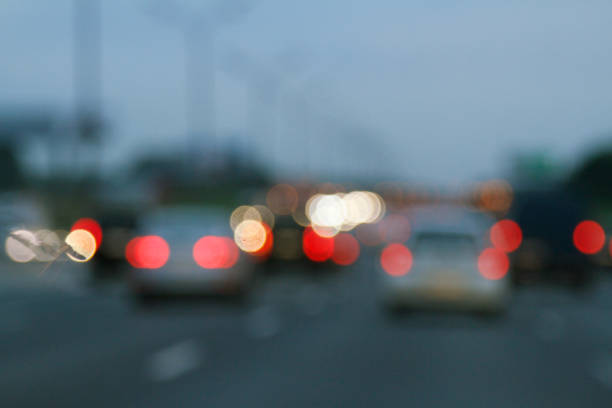 istock Blurred background with lights of cars 875606396
