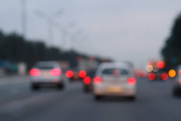 istock Blurred background with lights of cars 875606440