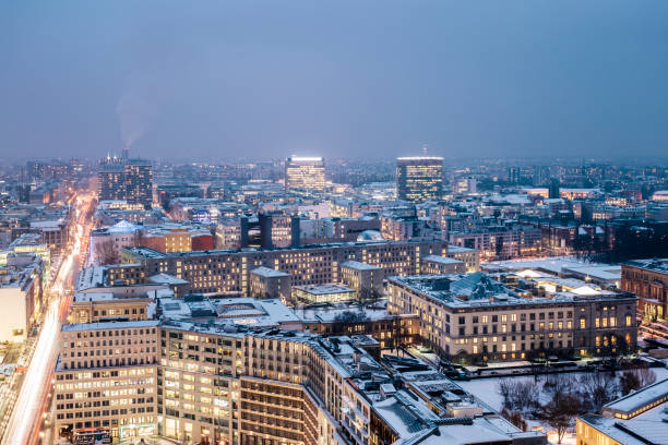 istock Winter cityscape with snow covered rooftops at night, Berlin, Germany 875607650