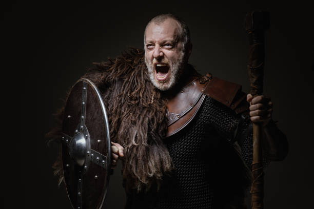 istock Handsome bloody viking male warrior in emotional pose 875617024