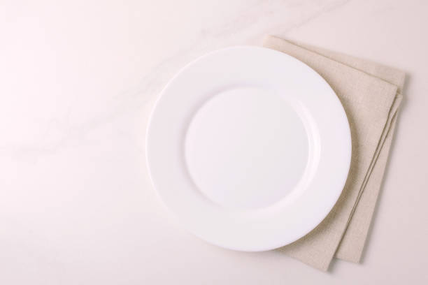 istock Food background. White empty plate, napkin. Top view, copyspace. 875618676
