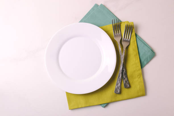 istock Food background. White empty plate, cutlery, napkin. Top view, copyspace. 875619166