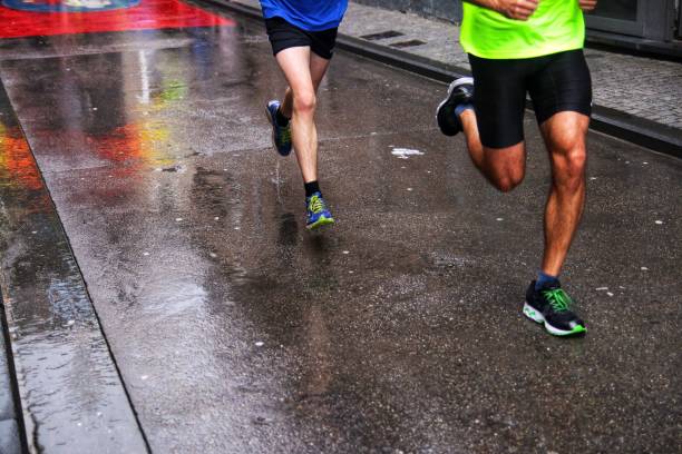 istock Street runners in the rain 875625756