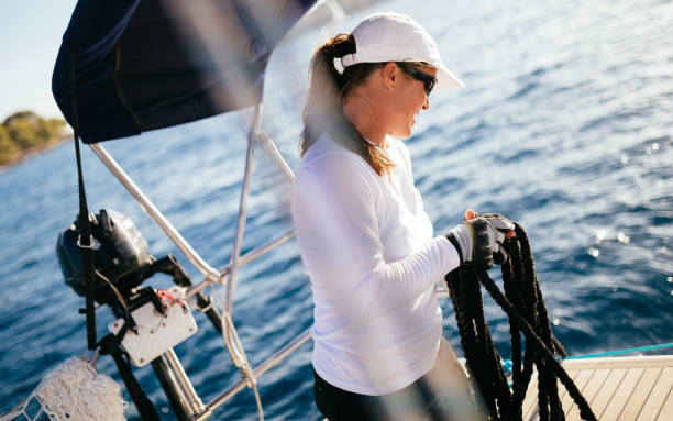 istock Attractive strong woman sailing with her boat 875626002
