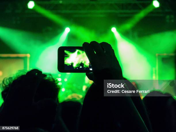 Smart Phone Filming A Gig Stock Photo - Download Image Now - Arts Culture and Entertainment, Back Lit, Concert Hall