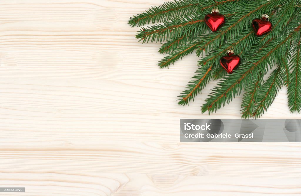 Christmas: spruce branches and red hearts Christmas background with spruce branches and red heart pendants Advent Stock Photo